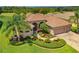 Attractive one-story home with landscaped yard and three-car garage, situated on a golf course at 13217 Thoroughbred Dr, Dade City, FL 33525