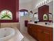 Elegant bathroom with double vanity and soaking tub at 13217 Thoroughbred Dr, Dade City, FL 33525