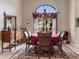 Formal dining room with a large window and chandelier at 13217 Thoroughbred Dr, Dade City, FL 33525