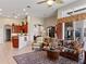 Open kitchen with a breakfast bar and wooden cabinets at 13217 Thoroughbred Dr, Dade City, FL 33525