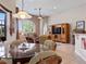 Bright living room with large windows and comfortable seating at 13217 Thoroughbred Dr, Dade City, FL 33525