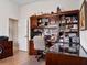 Home office with built-in desk and bookshelves at 13217 Thoroughbred Dr, Dade City, FL 33525