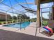 Large, refreshing pool with screened enclosure at 13217 Thoroughbred Dr, Dade City, FL 33525