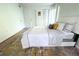 Bedroom with a queen-size bed, carpet flooring, and ample closet space at 1398 Shady Pine Way # H3, Tarpon Springs, FL 34688