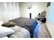 Cozy bedroom featuring a double bed and built-in closet at 1398 Shady Pine Way # H3, Tarpon Springs, FL 34688