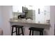 Small kitchen with stainless steel appliances and granite countertops at 1398 Shady Pine Way # H3, Tarpon Springs, FL 34688