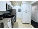 Bright kitchen with stainless steel appliances and ample cabinet space at 1398 Shady Pine Way # H3, Tarpon Springs, FL 34688
