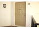 Condo entry with a modern door and light fixture at 1398 Shady Pine Way # H3, Tarpon Springs, FL 34688