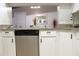 Kitchen features granite countertops and stainless steel dishwasher at 1398 Shady Pine Way # H3, Tarpon Springs, FL 34688