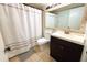 Updated bathroom with a toilet, vanity, and shower/tub combo at 1398 Shady Pine Way # H3, Tarpon Springs, FL 34688