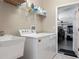 Laundry room with washer, dryer and utility sink at 13217 Thoroughbred Dr, Dade City, FL 33525
