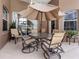 Outdoor patio furniture with umbrella, perfect for relaxing and entertaining at 13217 Thoroughbred Dr, Dade City, FL 33525
