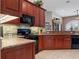 Modern kitchen with granite countertops and stainless steel appliances at 13217 Thoroughbred Dr, Dade City, FL 33525