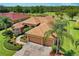 Aerial view of single Gathering home with two car garage and landscaped yard at 13217 Thoroughbred Dr, Dade City, FL 33525