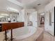 Bathroom with large bathtub and double sinks at 13217 Thoroughbred Dr, Dade City, FL 33525
