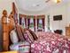 Main bedroom with king-size bed and access to backyard at 13217 Thoroughbred Dr, Dade City, FL 33525