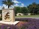 Lake Jovita community entrance with landscaping at 13217 Thoroughbred Dr, Dade City, FL 33525