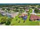 Aerial view of upscale homes, community pool, and golf course at 13217 Thoroughbred Dr, Dade City, FL 33525