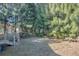 Wooded backyard with a privacy fence and deck at 1478 Alternate Keene Rd, Largo, FL 33771