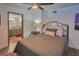 Bedroom with a ceiling fan and en suite bathroom at 1478 Alternate Keene Rd, Largo, FL 33771