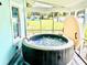 Enjoy this relaxing hot tub located on the screened porch at 1478 Alternate Keene Rd, Largo, FL 33771