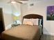 Bedroom with a queen bed and artwork at 1478 Alternate Keene Rd, Largo, FL 33771