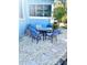 Charming patio area with a table and chairs, perfect for outdoor dining at 1478 Alternate Keene Rd, Largo, FL 33771