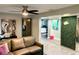 Living room with a sofa, and green wall at 1478 Alternate Keene Rd, Largo, FL 33771