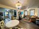 Open concept dining area with round table and chairs at 1478 Alternate Keene Rd, Largo, FL 33771