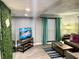 Living area featuring a flat-screen TV and comfortable seating at 1478 Alternate Keene Rd, Largo, FL 33771