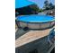 Refreshing above ground pool with wooden deck at 1478 Alternate Keene Rd, Largo, FL 33771