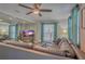 Spacious living room with sectional sofa and large TV at 1478 Alternate Keene Rd, Largo, FL 33771