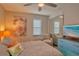 Bedroom with a queen bed, sitting chair, and built-in mirror at 1478 Alternate Keene Rd, Largo, FL 33771