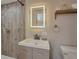 Bathroom with a walk-in shower and updated vanity at 1478 Alternate Keene Rd, Largo, FL 33771