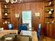 Kitchen with built-in shelving, a granite island, and blue chairs at 1478 Alternate Keene Rd, Largo, FL 33771