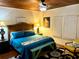 Bright bedroom with a king-size bed and wood floors at 1478 Alternate Keene Rd, Largo, FL 33771