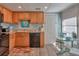 Kitchen with light wood cabinets and black appliances at 1478 Alternate Keene Rd, Largo, FL 33771