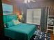 Cozy bedroom with a queen bed and nautical decor at 1478 Alternate Keene Rd, Largo, FL 33771