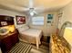 Cozy bedroom with a full-size bed and coastal decor at 1478 Alternate Keene Rd, Largo, FL 33771