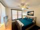 Second bedroom with a queen bed and coastal-themed decor at 1478 Alternate Keene Rd, Largo, FL 33771