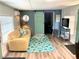 Living room with a tan couch and a view of the kitchen at 1478 Alternate Keene Rd, Largo, FL 33771