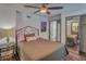 Bedroom with a ceiling fan and mirrored closet at 1478 Alternate Keene Rd, Largo, FL 33771