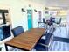 Screened porch with outdoor seating and dining area at 1478 Alternate Keene Rd, Largo, FL 33771