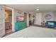 Bedroom with dresser, TV, and small seating area at 1478 Alternate Keene Rd, Largo, FL 33771