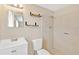 Clean bathroom with shower, toilet and floating vanity at 3234 Jackson Dr, Holiday, FL 34691