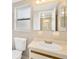 Clean bathroom with vanity, toilet and mirror at 3234 Jackson Dr, Holiday, FL 34691