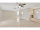 Bright living room with tile floors and view into kitchen at 3234 Jackson Dr, Holiday, FL 34691