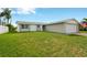 Ranch home with a spacious front yard at 3234 Jackson Dr, Holiday, FL 34691