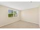 Simple bedroom with neutral walls and carpeted floor at 3234 Jackson Dr, Holiday, FL 34691