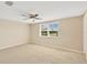 Bright bedroom with ceiling fan and neutral decor at 3234 Jackson Dr, Holiday, FL 34691
